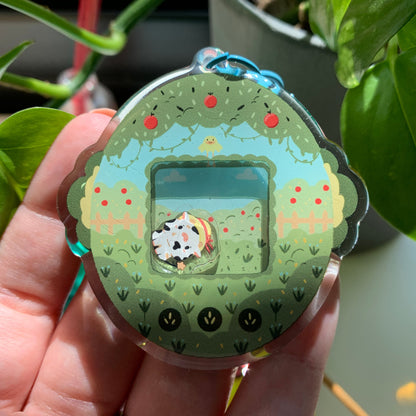 Llavero vaquita blanca | Tamagotchi shaker